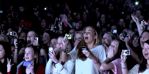 GIF of screaming concert fans